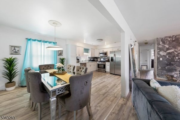 Dining room, Interior, Kitchen, Pendant Lights, Stainless Steel Appliances, Wood Texture Flooring