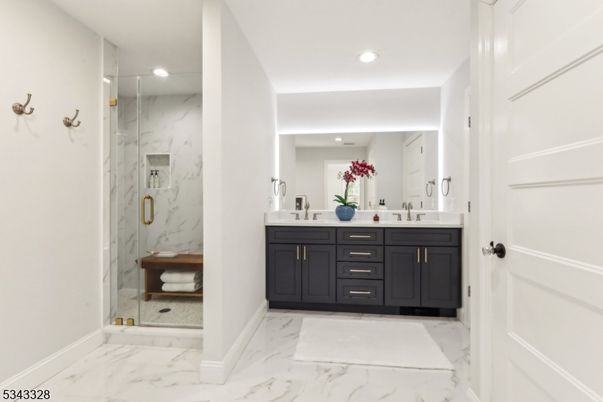 Bathroom, Dual Sink Vanities, Glass Shower, Interior, Marble, Marble Walls, Recessed Lighting