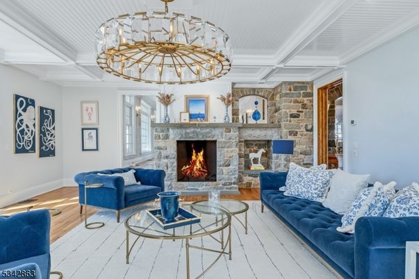 Chandelier, Fireplace, Interior, Living room, Stone Walls, Wood Texture Flooring