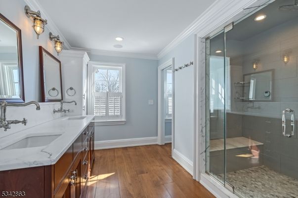 Bathroom, Dual Sink Vanities, Glass Shower, Interior, Recessed Lighting, Wood Texture Flooring