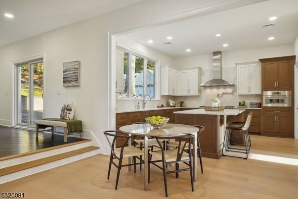 Dining room, Interior, Kitchen, Recessed Lighting, Stainless Steel Appliances, Wood Texture Flooring