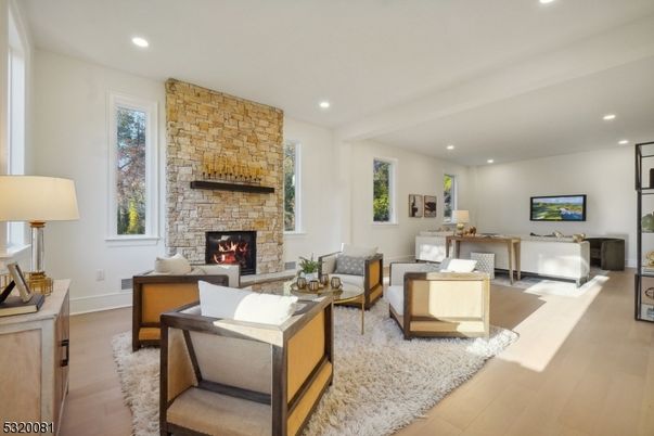 Fireplace, Interior, Living room, Recessed Lighting, Stone Walls, Wood Texture Flooring