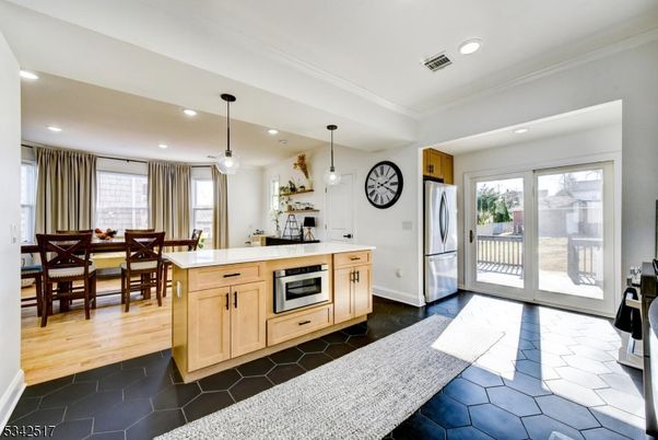 Dining room, Interior, Kitchen, Pendant Lights, Recessed Lighting, Stainless Steel Appliances, Wood Texture Flooring