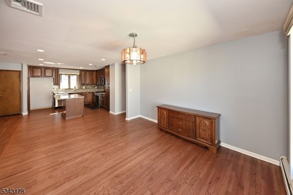 Chandelier, Interior, Kitchen, Recessed Lighting, Stainless Steel Appliances, Wood Texture Flooring