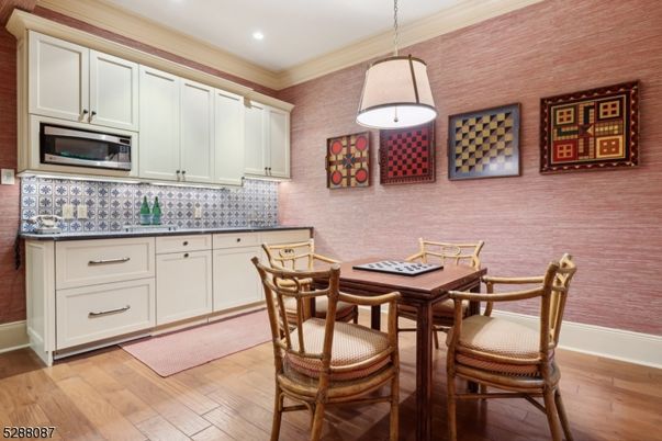 Dining room, Interior, Kitchen, Pendant Lights, Recessed Lighting, Stainless Steel Appliances, Wood Texture Flooring