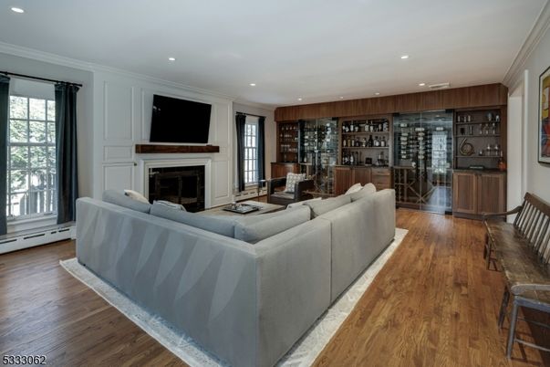Fireplace, Interior, Living room, Recessed Lighting, Wine Storage, Wood Texture Flooring