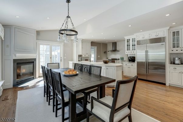 Dining room, Fireplace, Interior, Kitchen, Pendant Lights, Recessed Lighting, Stainless Steel Appliances, Wood Texture Flooring