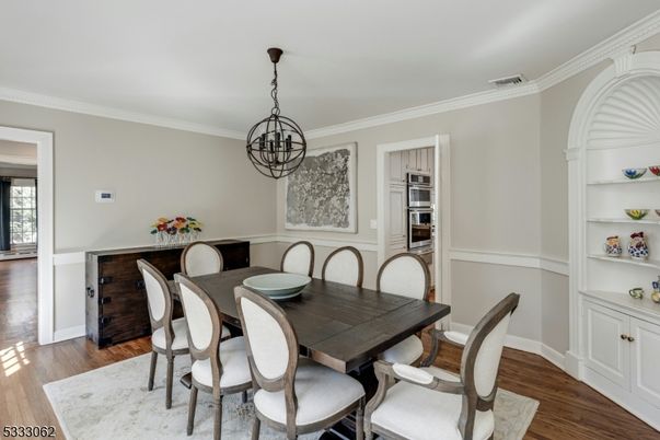 Chandelier, Dining room, Interior, Kitchen, Pendant Lights, Stainless Steel Appliances, Wood Texture Flooring