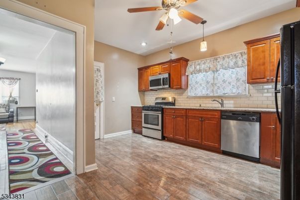 Interior, Kitchen, Pendant Lights, Recessed Lighting, Stainless Steel Appliances, Wood Texture Flooring