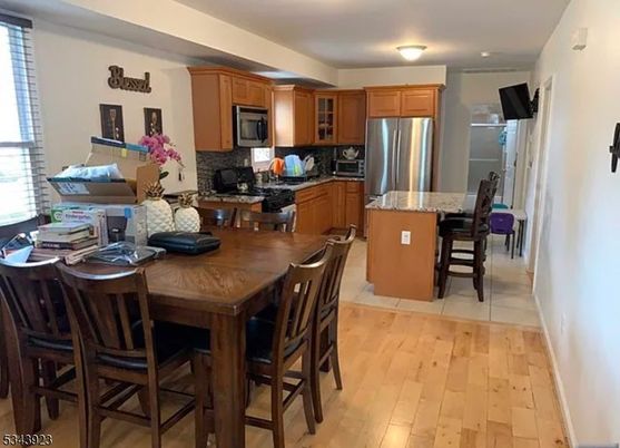 Dining room, Interior, Kitchen, Recessed Lighting, Stainless Steel Appliances, Wood Texture Flooring