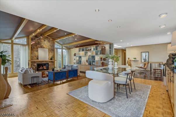 Dining room, Fireplace, Interior, Living room, Pendant Lights, Recessed Lighting, Stone Walls, Wooden Beams, Wood Texture Flooring