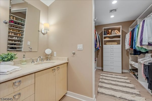 Bathroom, Dual Sink Vanities, Interior, Recessed Lighting, Walk-in Closets