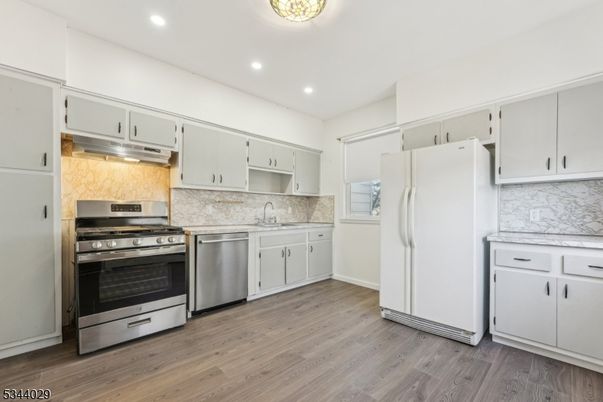 Interior, Kitchen, Recessed Lighting, Stainless Steel Appliances, Wood Texture Flooring