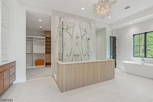 Bathroom, Chandelier, Dual Sink Vanities, Free Standing Baths, Interior, Marble Walls, Recessed Lighting, Walk-in Closets