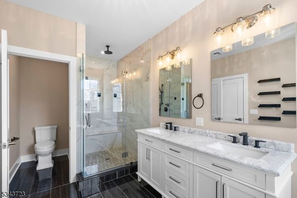 Bathroom, Dual Sink Vanities, Glass Shower, Interior, Marble Walls, Wood Texture Flooring