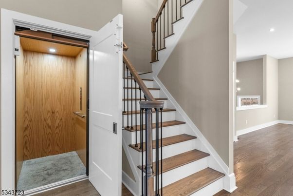 Elevator, Interior, Recessed Lighting, Wood Texture Flooring, Wooden Walls