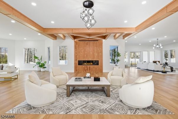 Chandelier, Fireplace, Interior, Living room, Pendant Lights, Recessed Lighting, Wooden Beams, Wood Texture Flooring