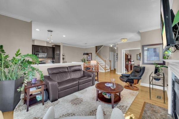 Fireplace, Interior, Kitchen, Living room, Pendant Lights, Recessed Lighting, Stainless Steel Appliances, Wood Texture Flooring