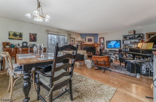 Dining room, Fireplace, Interior, Living room, Pendant Lights, Piano, Wood Texture Flooring