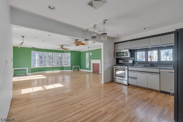 Interior, Kitchen, Pendant Lights, Recessed Lighting, Stainless Steel Appliances, Wood Texture Flooring