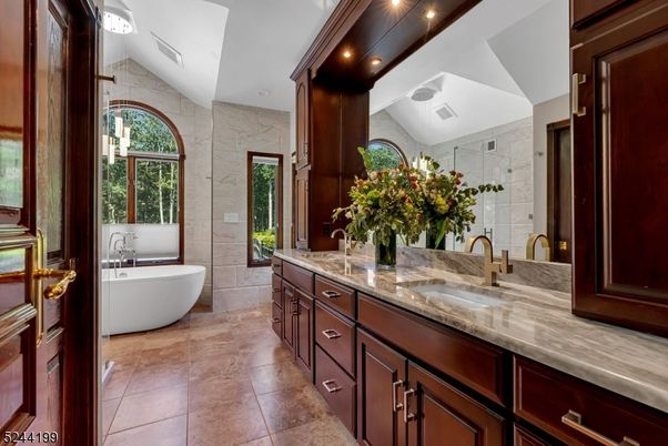 Bathroom, Dual Sink Vanities, Free Standing Baths, Glass Shower, Interior, Recessed Lighting, Stone Walls
