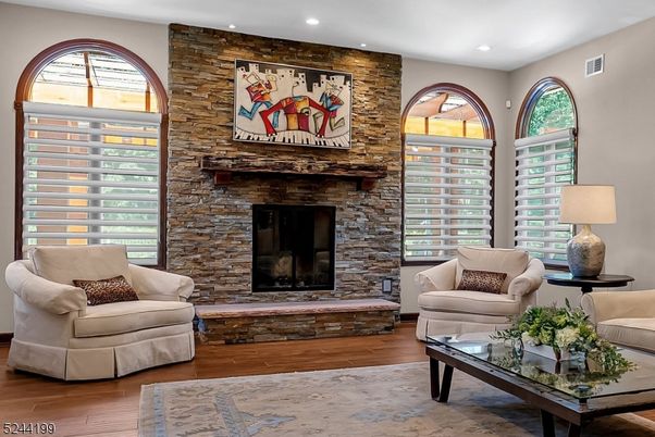Fireplace, Interior, Living room, Recessed Lighting, Stone Walls, Wood Texture Flooring