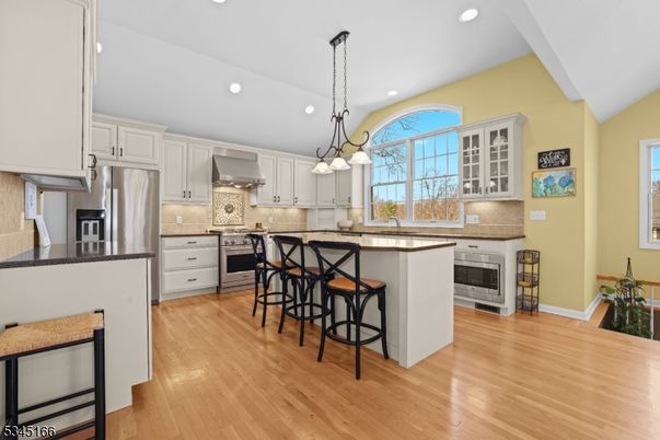 Chandelier, Interior, Kitchen, Pendant Lights, Recessed Lighting, Stainless Steel Appliances, Wood Texture Flooring