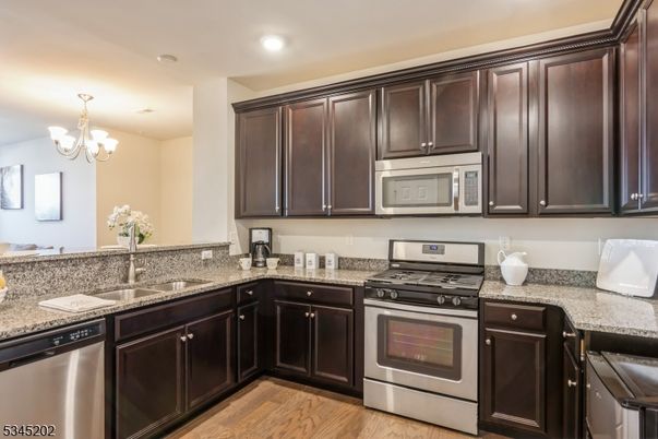 Chandelier, Interior, Kitchen, Recessed Lighting, Stainless Steel Appliances, Wood Texture Flooring