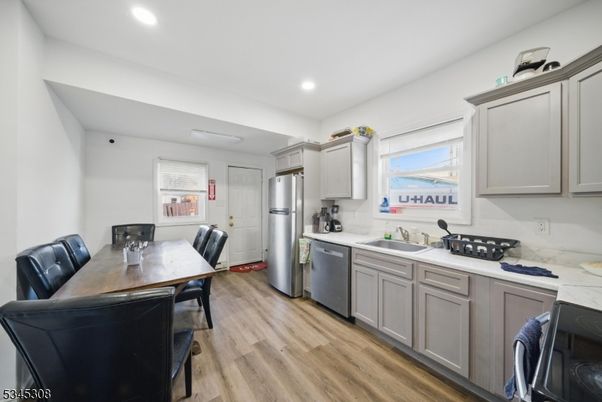 Dining room, Interior, Kitchen, Recessed Lighting, Stainless Steel Appliances, Wood Texture Flooring