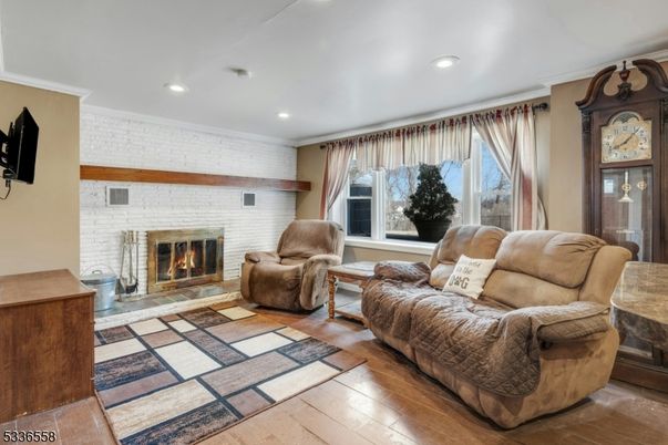 Fireplace, Interior, Living room, Recessed Lighting, Stone Walls, Wood Texture Flooring