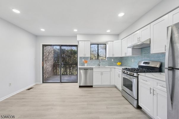 Interior, Kitchen, Recessed Lighting, Stainless Steel Appliances, Wood Texture Flooring