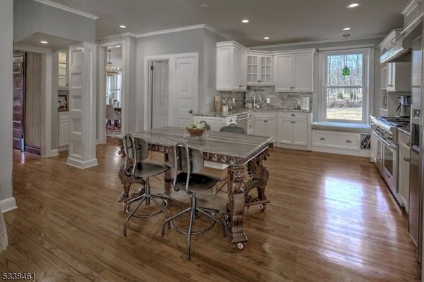 Dining room, Interior, Kitchen, Recessed Lighting, Stainless Steel Appliances, Wood Texture Flooring