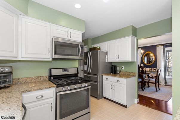 Dining room, Interior, Kitchen, Recessed Lighting, Stainless Steel Appliances, Wood Texture Flooring