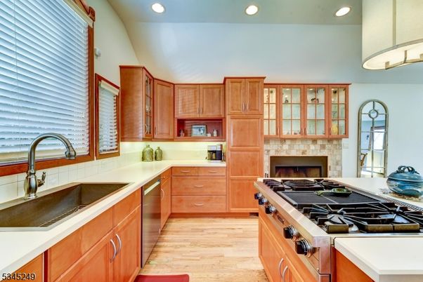 Fireplace, Interior, Kitchen, Recessed Lighting, Stainless Steel Appliances, Wood Texture Flooring