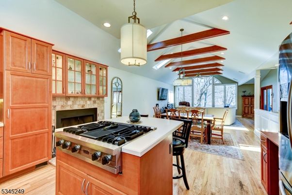 Dining room, Fireplace, Interior, Kitchen, Living room, Pendant Lights, Recessed Lighting, Stainless Steel Appliances, Wooden Beams, Wood Texture Flooring
