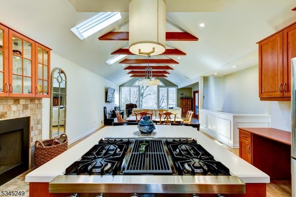 Dining room, Fireplace, Interior, Kitchen, Living room, Pendant Lights, Recessed Lighting, Stainless Steel Appliances, Wood Texture Flooring