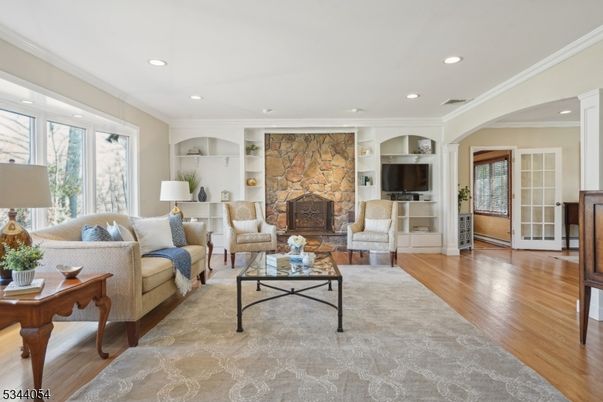 Fireplace, Interior, Living room, Recessed Lighting, Stone Walls, Wood Texture Flooring