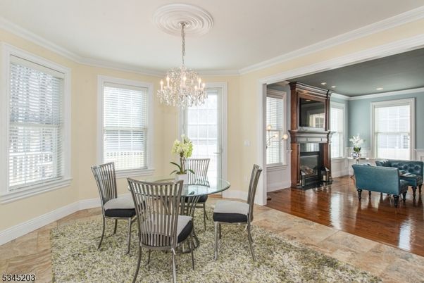Chandelier, Dining room, Fireplace, Interior, Living room, Recessed Lighting, Wood Texture Flooring