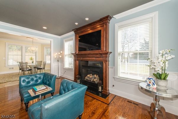 Chandelier, Dining room, Fireplace, Interior, Living room, Recessed Lighting, Wood Texture Flooring