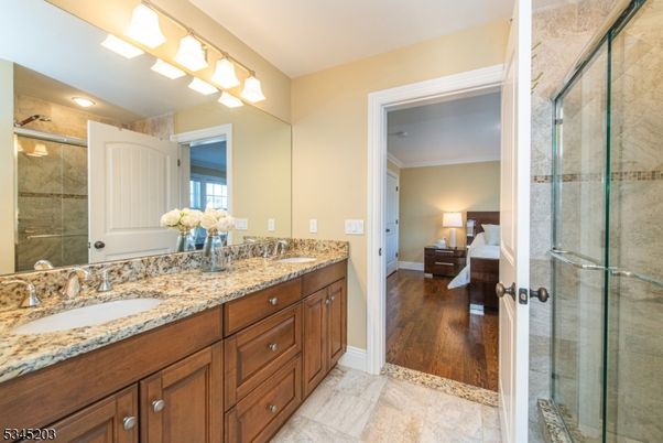Bathroom, Bedroom, Dual Sink Vanities, Glass Shower, Interior, Wood Texture Flooring