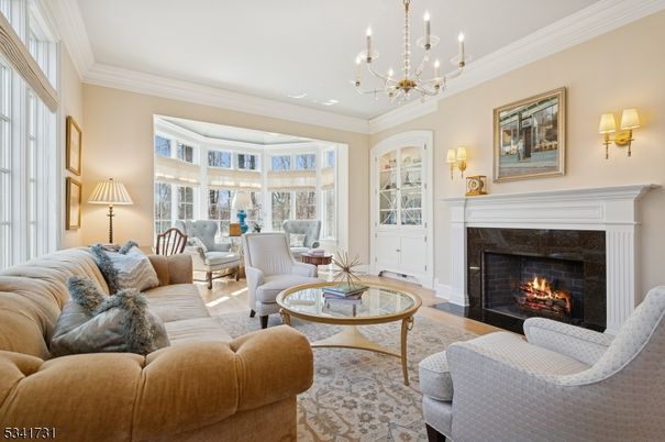 Chandelier, Fireplace, Interior, Living room, Recessed Lighting, Wood Texture Flooring