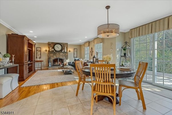 Dining room, Fireplace, Interior, Living room, Pendant Lights, Recessed Lighting, Wood Texture Flooring