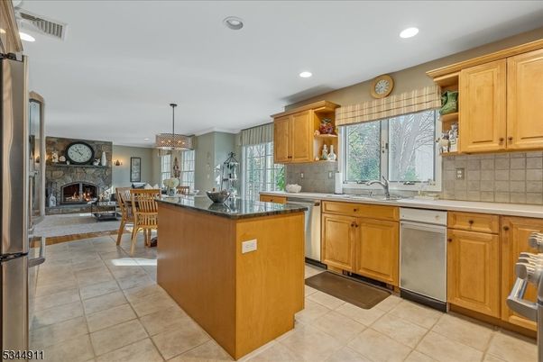 Chandelier, Dining room, Fireplace, Interior, Kitchen, Pendant Lights, Recessed Lighting, Stainless Steel Appliances