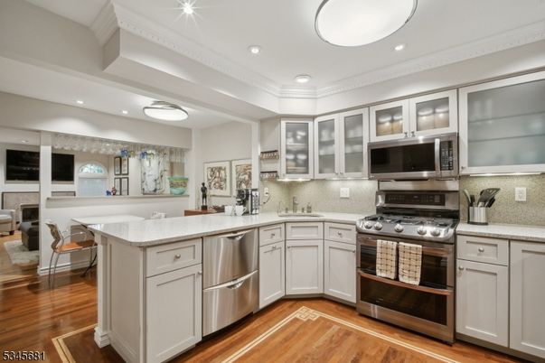 Dining room, Interior, Kitchen, Recessed Lighting, Stainless Steel Appliances, Wood Texture Flooring