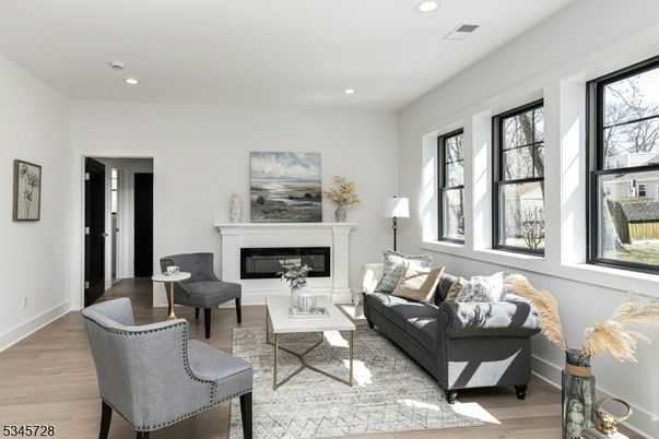 Fireplace, Interior, Living room, Recessed Lighting, Wood Texture Flooring