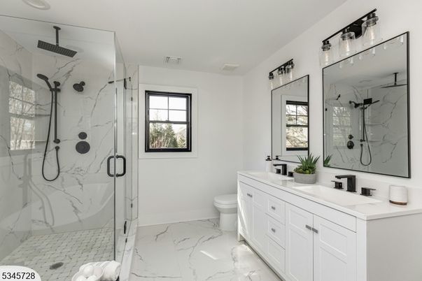 Bathroom, Dual Sink Vanities, Glass Shower, Interior, Marble, Marble Walls, Recessed Lighting