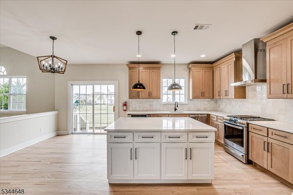 Chandelier, Interior, Kitchen, Pendant Lights, Recessed Lighting, Stainless Steel Appliances, Wood Texture Flooring