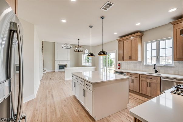 Fireplace, Interior, Kitchen, Pendant Lights, Recessed Lighting, Stainless Steel Appliances, Wood Texture Flooring