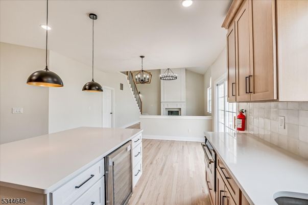 Chandelier, Fireplace, Interior, Kitchen, Pendant Lights, Recessed Lighting, Wood Texture Flooring