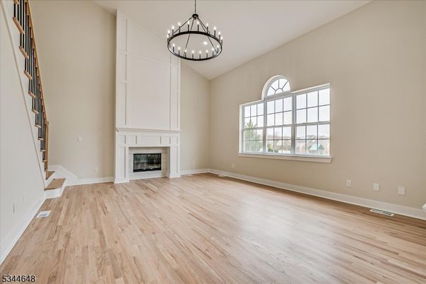 Empty room, Fireplace, Interior, Pendant Lights, Wood Texture Flooring